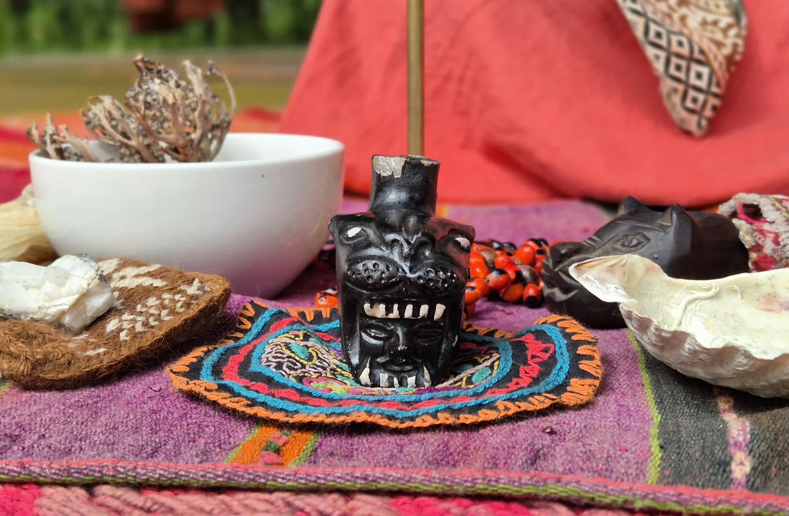 Mesa detail with herbs and sacred objects