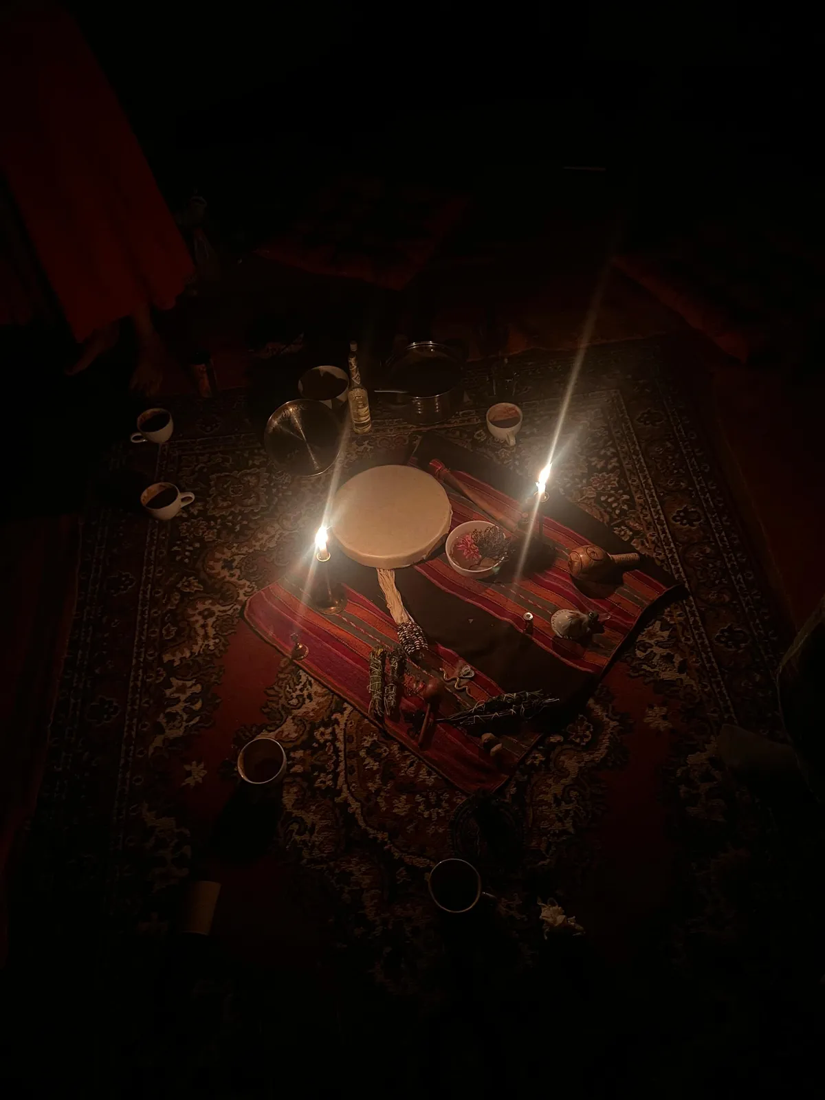 Ceremonial mesa with candles burning at night